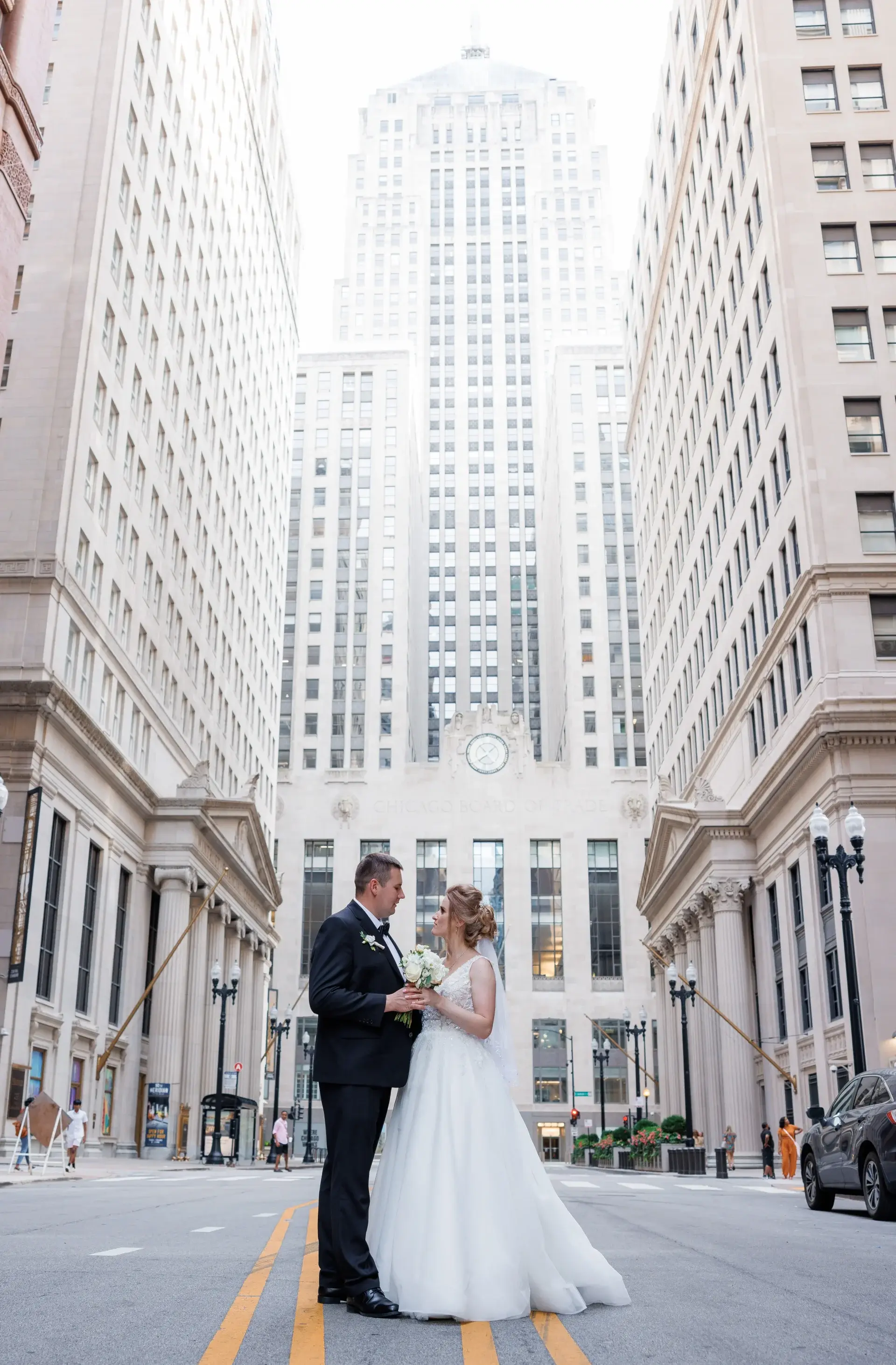 Bride and groom embracing in golden light — fine art wedding photography in Chicago